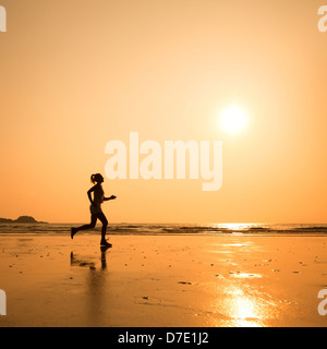 run to purpose, woman silhouette on the beach