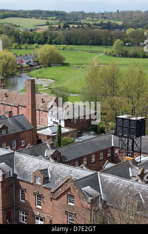 The gray-slate rooftops of the Walnut Tree hospital in Sudbury, with the common-land countryside beyond. Stock Photo