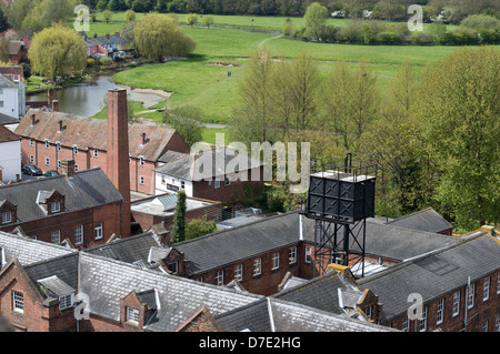 The gray-slate rooftops of the Walnut Tree hospital in Sudbury, with the common-land countryside beyond. Stock Photo