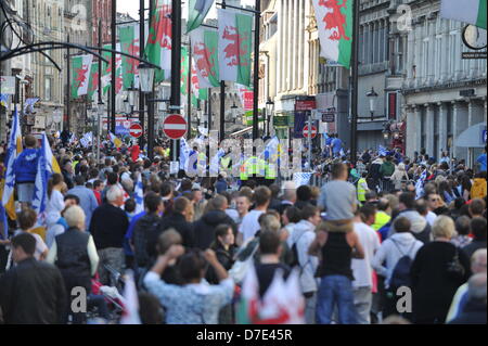 CARDIFF, UK. 5th May 2013. Crowds gather on St Mary Street in preparation for the Cardiff City Champions Parade.The team were paraded through the city in an open top bus after winning the Championship and being promoted to the Premier League. Stock Photo