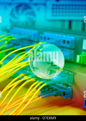 globe with network cables and servers in a technology data center Stock Photo