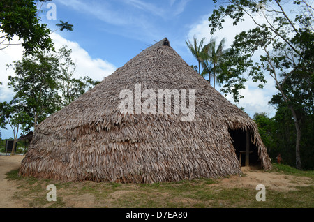 an Amazonian straw hut in a Yagua tribe community near Iquitos, Peru Stock Photo