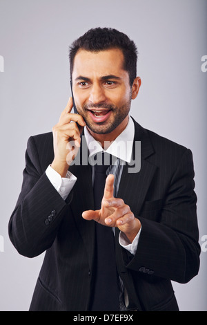 Successful businessman having a phone conversation Stock Photo