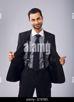 Portrait of a cute and cheerful young professional holding open his coat Stock Photo