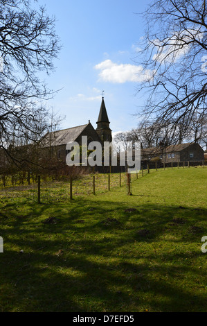 Village church seen from the River Wharfe in Burnsall on the Dales Way Long Distance Footpath Wharfedale Yorkshire. Stock Photo