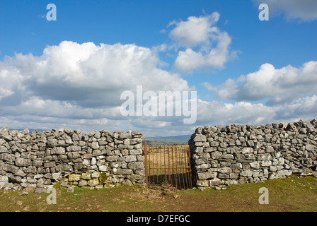 Kissing gate in dry stone wall, Cumbria, England UK Stock Photo