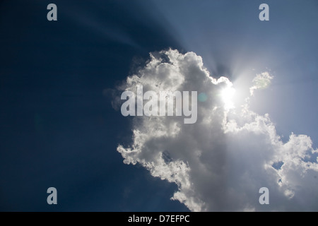 sun shining through clouds Stock Photo