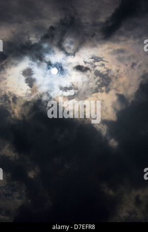 sun shining through clouds Stock Photo