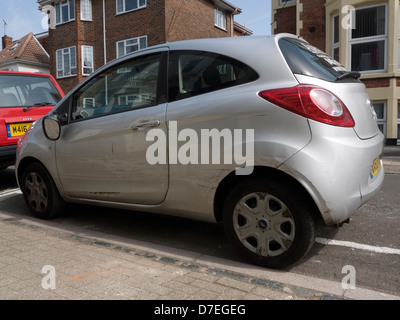 car showing scrapes along side after being involved in an accident Stock Photo