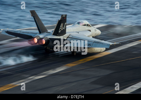 An F/A-18F lanches from USS Dwight D. Eisenhower. Stock Photo