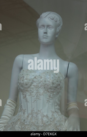 A display of fashion mannequin in clothing and accessories shop window Stock Photo