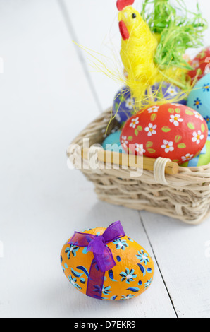 Easter decorations eggs with painted flowers on white table Stock Photo