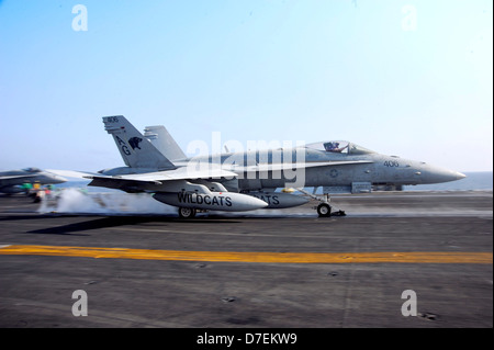 An F/A-18E launces from USS Dwight D. Eisenhower. Stock Photo