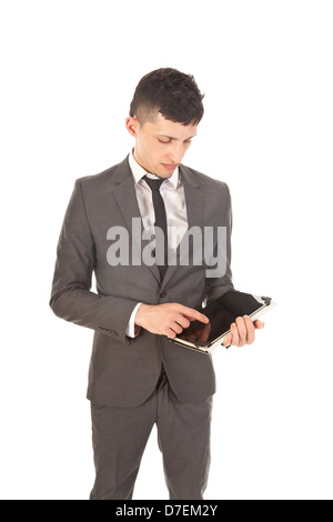 Young man holding a black tablet isolated on white Stock Photo