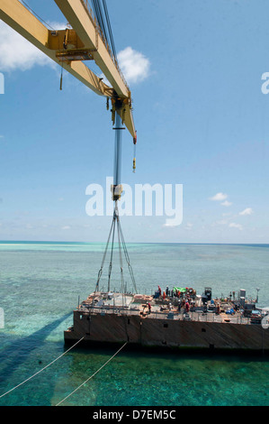 A crane prepares to lift the first-in-class aircraft carrier USS Gerald ...