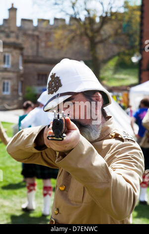 Lincoln, UK. 6th May, 2013. Victorian Weekend at Lincoln Castle in Lincolnshire Uk. People dressed in traditional Victorian The Home Guard (initially 'Local Defence Volunteers' or LDV) was a defence organisation of the British Army during the Second World War. of the era soldier aiming musket Credit: Paul Thompson/Alamy Live News Stock Photo