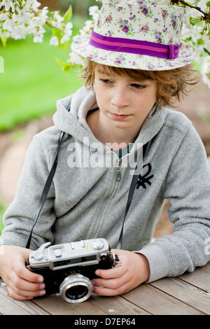 Child playing classic, old-school string game and didactic toy with her ...
