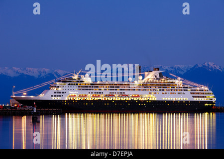 Cruise ship Statendam berthed at dock at dusk with Olympic mountains in background-Victoria, British Columbia, Canada. Stock Photo