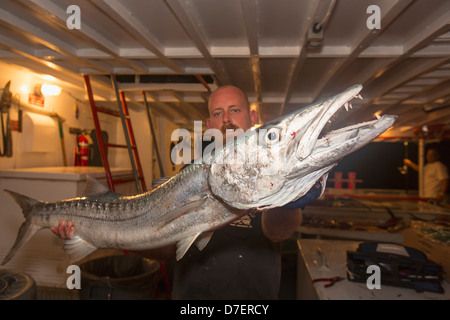 Man holding barracuda hi-res stock photography and images - Alamy