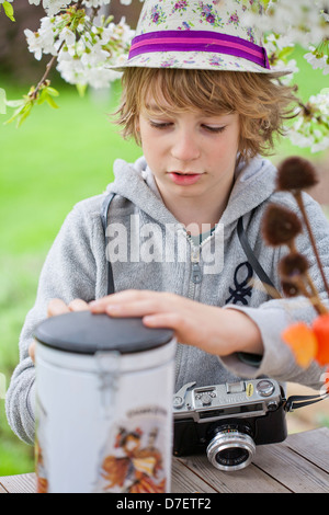 Child playing classic, old-school string game and didactic toy with her ...