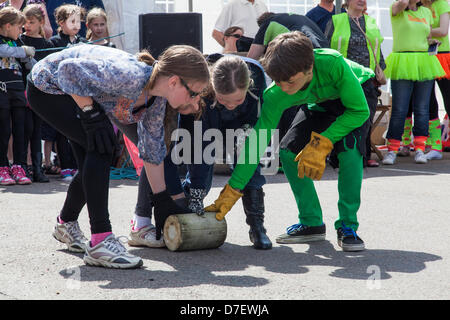 Team of 4 children line up for annual cheese rolling contest held in the Cambridgeshire village of Stilton. The event is held on the first May Bank Holday each year. With this year's wonderful weather many teams took part and the village was full to capacity with visitors enjoying the great weather and fun events. Credit: Stock Photo