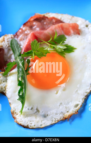 Fried egg and ham on a plate Stock Photo