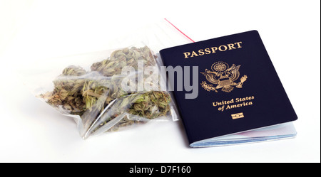 A USA passport and a zip-lock plastic bag containing marijuna buds isolated on white background. Stock Photo