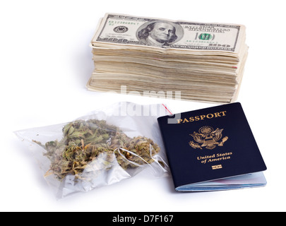 A USA passport zip-lock plastic bag containing marijuna buds large stack 100 US dollar money notes isolated on white background. Stock Photo