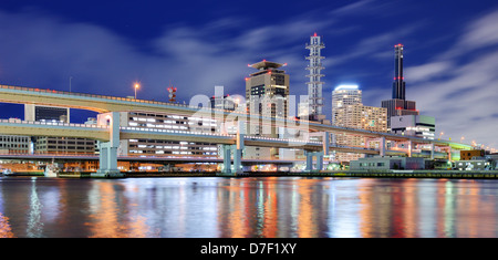 Modern cityscape with natural reflections in a puddle of Kobe, Japan. Stock Photo