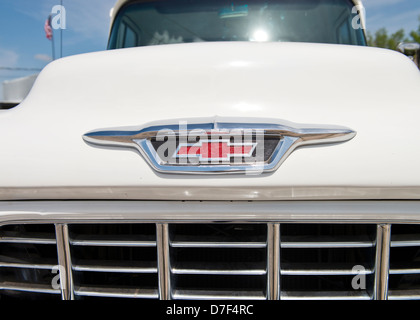 A white, classic 1955 Chevrolet V8 pickup front end closeup. American classic pickup, USA. Stock Photo