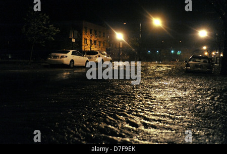 BROOKLYN, NY - OCTOBER 29: Flooded cars, caused by Hurricane Sandy, are seen on October 29, 2012, in the corner of Bragg street Stock Photo