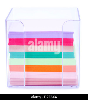 A colorful stack of notes inside a transparent plastic note holder ...
