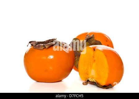 fresh persimmon fruit on a white background Stock Photo