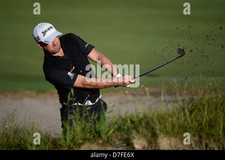 Melbourne, Australia. 14-11-12. Graeme McDowell from Ireland plays a bunker shot in the Australian Masters pro am Stock Photo