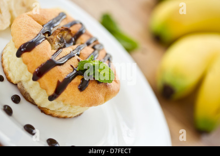 cheese cakes with bananas in chocolate with mint Stock Photo