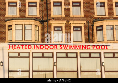 Facade of a seafront Blackpool hotel on New Promenade South proclaiming the facility of a heated indoor swimming pool. Stock Photo