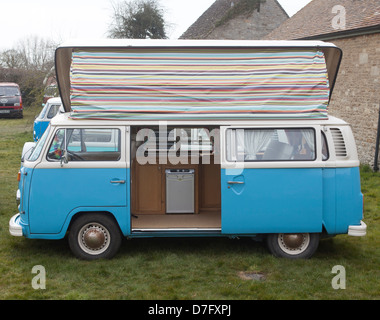 A vintage retro VW camper van parked at the seaside in the summer ...
