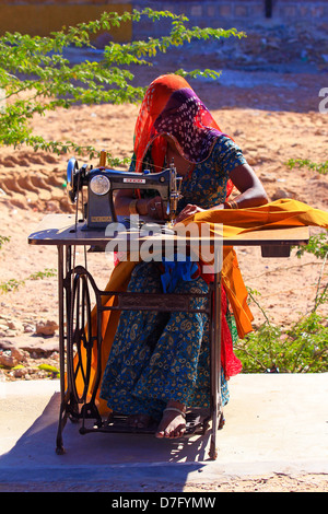 Woman sewing Stock Photo