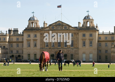 Badminton Horse Trials UK. Badminton House, competitor let btheior horses relax in front of the Badminton House. Badminton Estate, Gloucestershire England  4th May 2013 2010s HOMER SYKES Stock Photo