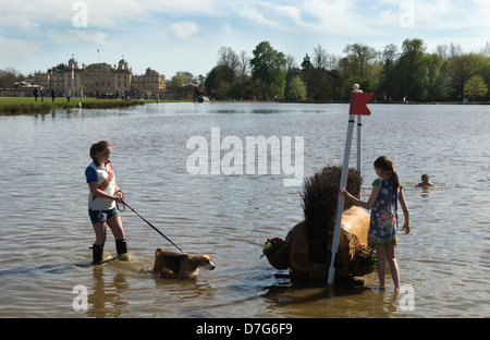 Badminton House during the Badminton Horse Trials. Children playing in The Lake at the end of the day 2013. 2010S UK HOMER SYKES Stock Photo