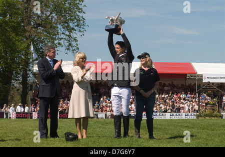 Badminton Horse Trials, New Zealand's Jonathan Jock Paget triumphed in an extraordinary climax to Britain's Mitsubishi Motors Badminton Horse Trials, seen here with Uk chairman of Mitsubishi Motors Lance Bradley  prizes being handed out by HRH Duchess of Cornwall Camilla Parker Bowles, the groom to right of photo. He won on Clifton Promise. Badminton, Gloucestershire, England 6th May 2013. May 2013. 2010s UK  HOMER SYKES Stock Photo