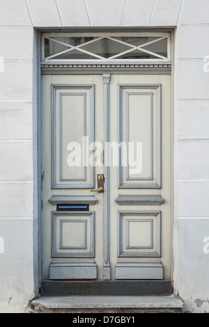 Old wooden door with decoration elements in old town of Tallinn, Estonia Stock Photo