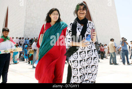 Girl wearing Imran Khan shirt seen excited to welcome Tehreek Insaf chairman on the occasion of his arrival at Quaid-e-Azam Muhammad Ali Jinnah mausoleum in Karachi on Tuesday, May 07, 2013. Stock Photo