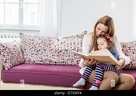 Mother and daughter reading Stock Photo