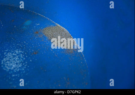 Gold sand in blue pan. Nordland, Norway. Stock Photo