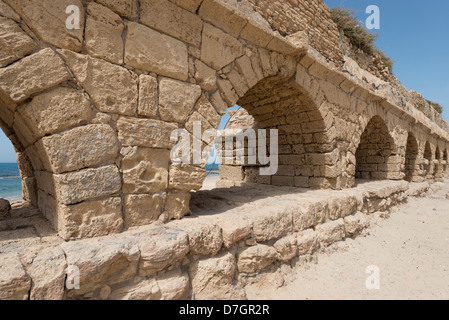 Remains of the Roman aqueduct in Caesarea, Israel Stock Photo