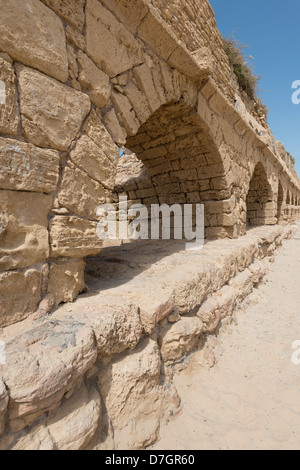 Remains of the Roman aqueduct in Caesarea, Israel Stock Photo