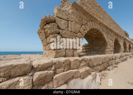 Remains of the Roman aqueduct in Caesarea, Israel Stock Photo