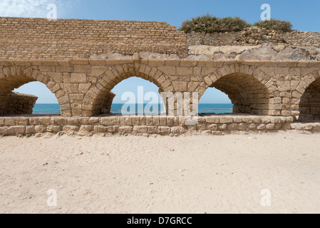 Remains of the Roman aqueduct in Caesarea, Israel Stock Photo