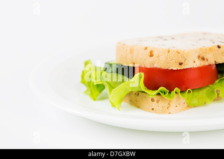 Healthy vegetarian meat free burgers on round chopping board with vegetables  and spinach on light background Stock Photo - Alamy